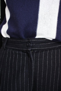 PINSTRIPED WOOL TAPERED PANTS